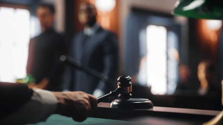 judge hitting gavel in courtroom