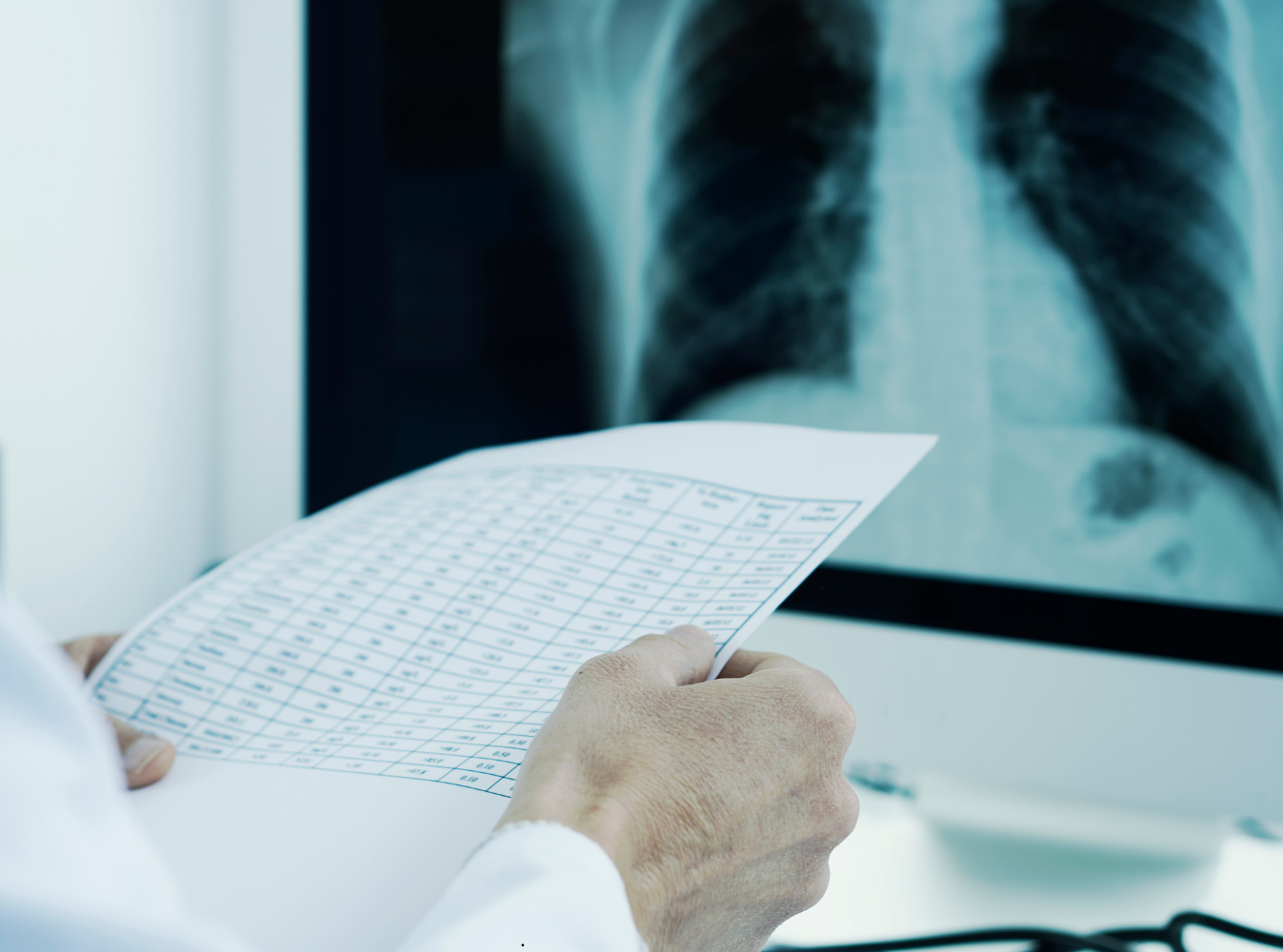 a doctor looking at an xray