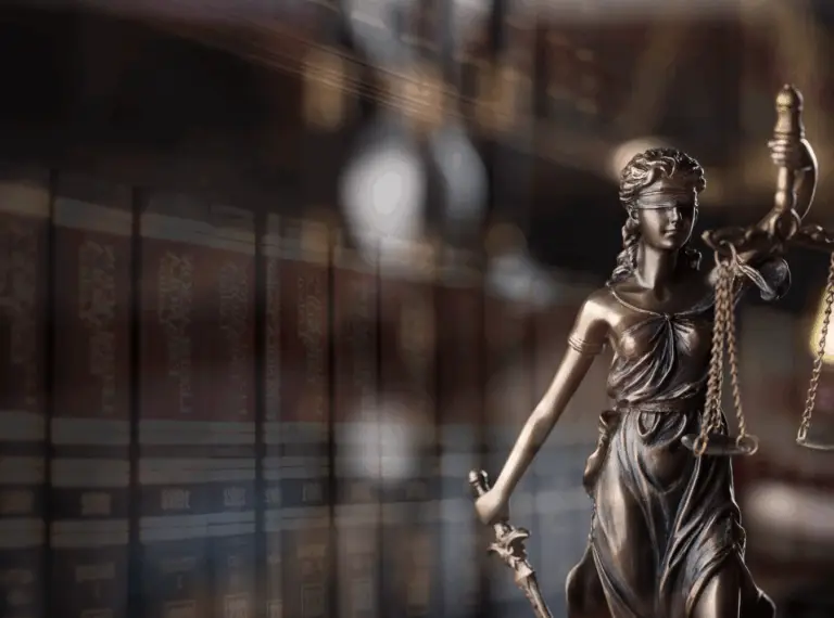 books and lady justice statue