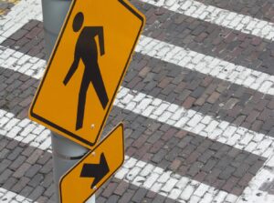 crosswalk and pedestrian sign
