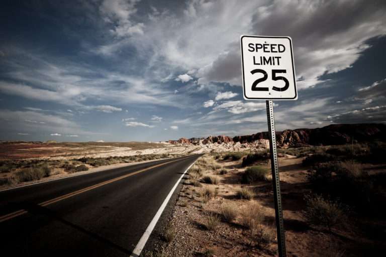 open road with a 25 mph speed limit sign