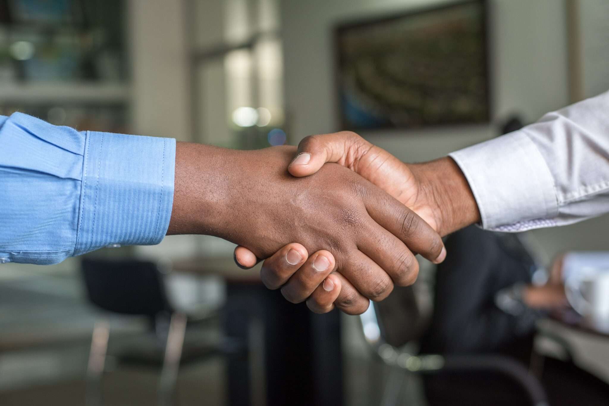 framed shot of two men shaking hands