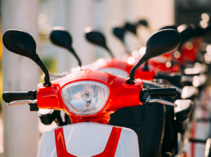 line of red mopeds close up