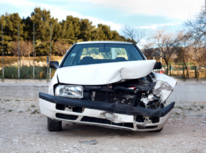 a white car with front end damage