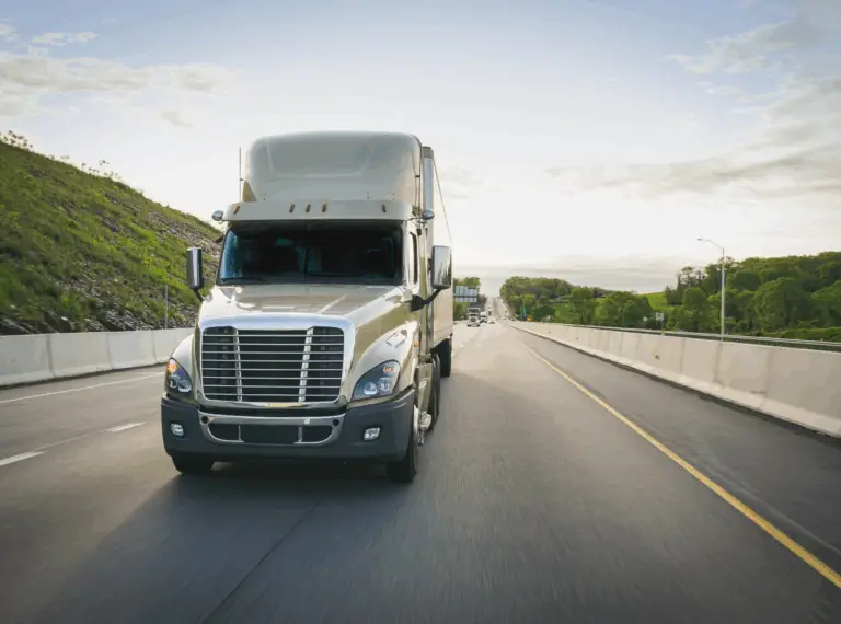 tractor trailer vehicle on the highway towards the camera