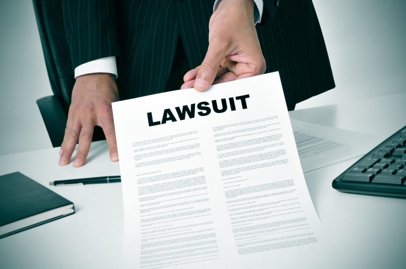 Lawyer showing lawsuit documents